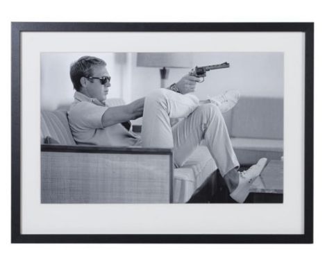 STEVE MCQUEEN WITH A GUN, photographic print, framed and glazed, 54cm x 74cm. 