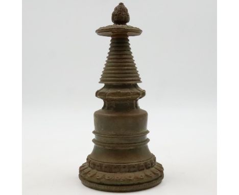 An early Tibetan Bronze stupa, possibly 13th century, showing traditional Buddhist elements, rising from a double lotus base 