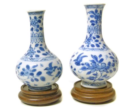 Pair of Chinese Kangxi period (1662-1722) vases, (both with restuck sections) 10cm high We are unable to do condition reports