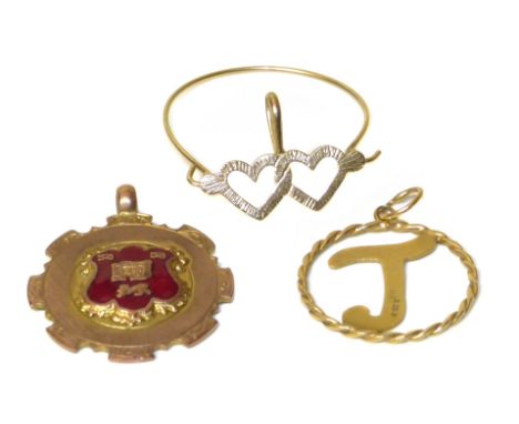 Three 9ct gold pendants, to include an enamel medallion with Staffordshire knot motif, a 9ct gold heart pendant and a 9ct gol