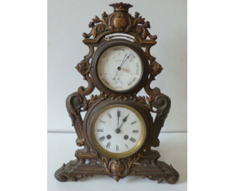 Victorian cast iron 8-day mantle clock enclosing an aneroid barometer (J-J Wainwright &amp; Co, Birmingham) and thermometer W