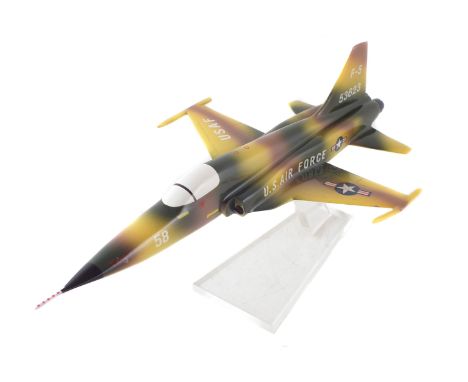 All metal scale model of a U.S.A.F Northrop F-5 jet fighter aircraft, with perspex stand, 35.5cm long