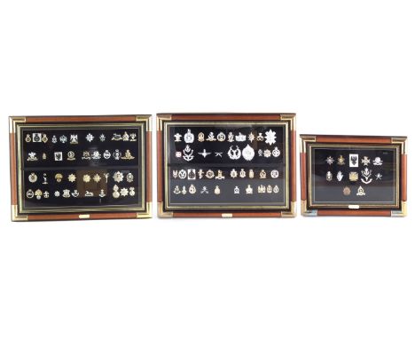 Ninety two British Army and Police cap badges, in three framed sets, the largest measures 50cm x 68cmCondition report: 80