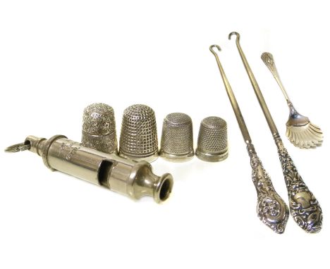 Four silver thimbles and an Acme girl guide silver plated whistle and two silver handled button hooks. We are unable to do co