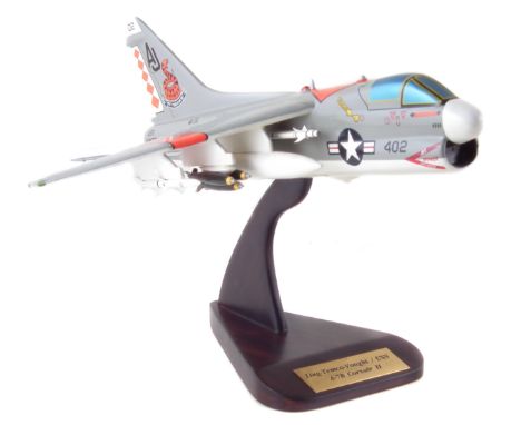 Hardwood scale model of a US Navy LTV A7B Corsair II attack jet fighter aircraft, with wood stand and original packing box, w