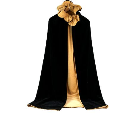 Vintage black velvet cloak with deep gathered collar and soft gold velvet lining .    