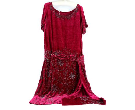 A 1930s with possible later adaption's raspberry red silk velvet dress with large scale design sewn with glass beads .    Goo