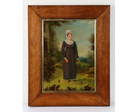 19th Century British Primitive school, of a lady standing in a garden holding a bible and a rose, housed within a wide oak fr