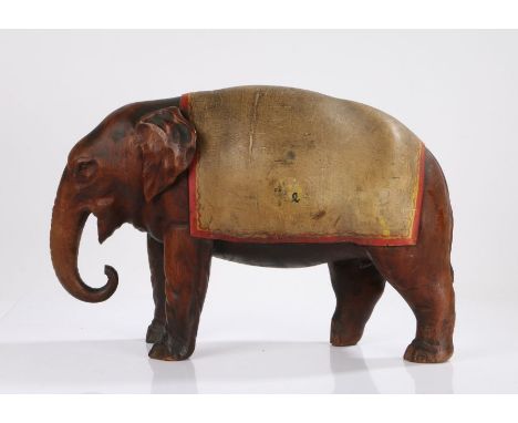 Large late 19th Century carved model elephant, probably Tobacco/Ale advertising related, with a large yellow and red/yellow e