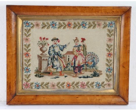 19th Century woolwork picture, of a couple in Oriental costume in a garden, housed within a maple frame, 49cm x 39cm includin