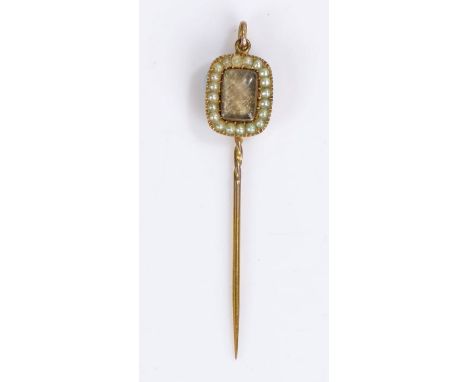 George III Mourning pendant, with woven hair and pearl surround to the front, the back of the pendant in black and white enam
