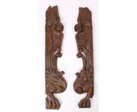 Pair of large late 17th Century carved oak architectural pilasters, with winged angles above scrolls terminating with acanthu