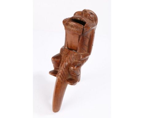 Unusual late 19th Century nutcracker, of large proportions, the figure holding onto the lever, his face with mutton chops and
