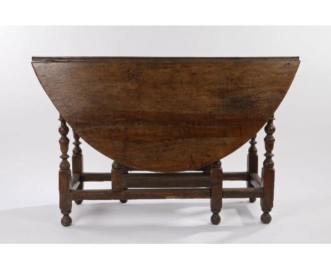 18th Century oak gate leg table, with D shaped leaves, raised on turned legs and chamfered stretchers, 44cm wide extending to