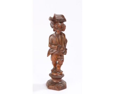 Early 19th Century nutcracker, of a standing man with tricorn hat, one hand inside his jacket raised on a stepped base, the b