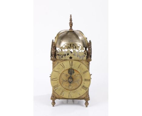 18th Century brass lantern clock, of large proportions, the finial top above four brass arched arms and a steel bell above th