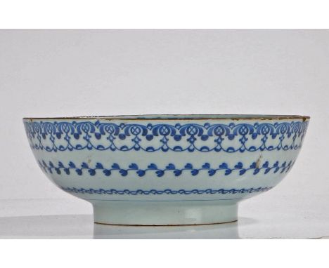 18th Century tin glazed bowl, the centre of the bowl with a "Kangxi" style leaf with further sprigs and geometric edge, the o