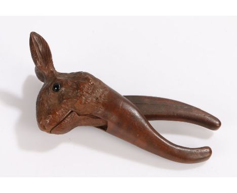 19th Century nutcracker, carved in softwood as a rabbit/hare set with dark coloured eyes, 16cm long&nbsp;