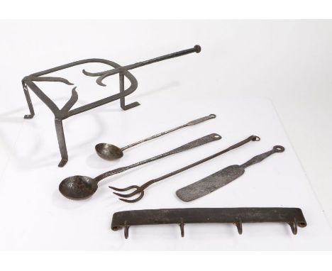 Metalwork, to include an 18th Century trivet, two ladles, a fork, a set of hooks and a spatula, (6)