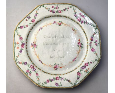 A rare famille rose octagonal dish, decorated at the rim with flower festoons; the centre decorated en-grisaille with the leg