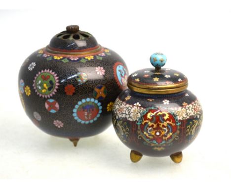 Two Japanese cloisonne enamel, tripod koro; each one with domed cover. The smaller with a design of sakura petals on both cov