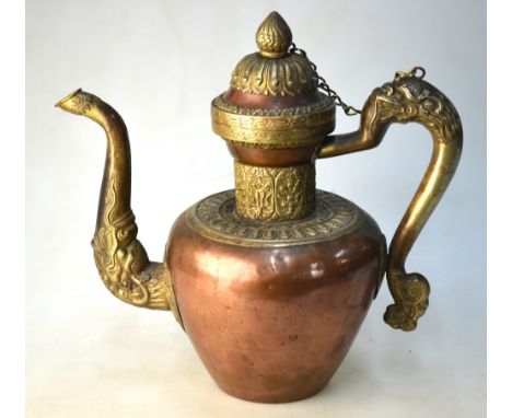 A Tibetan or Himalayan copper alloy teapot or ewer with animal handle and spout; 27cm high, 19th/20th Century Condition Repor