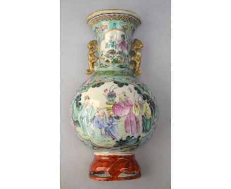 A scarce famille rose, wall-hanging vase with gilt handles; decorated with a central panel depicting four scholars, 21cm high