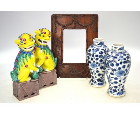 A pair of blue and white vases, 20 cm high, each one with Kangxi four-character mark, but not of the period; together with a 