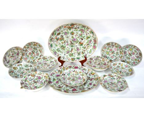 A Canton famille rose part service, comprising: two oval tureen stands (48 cm. diameter); four circular warming plates (28cm)