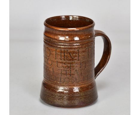 MICHAEL CARDEW (1901-1983) for Winchcombe Pottery; a slipware calligraphic tankard covered in rich treacle glaze, incised ser