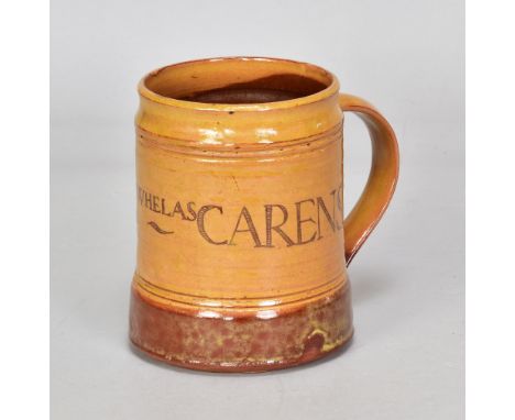 MICHAEL CARDEW (1901-1983) for Winchcombe Pottery; a slipware calligraphic tankard partially covered in galena glaze , incise