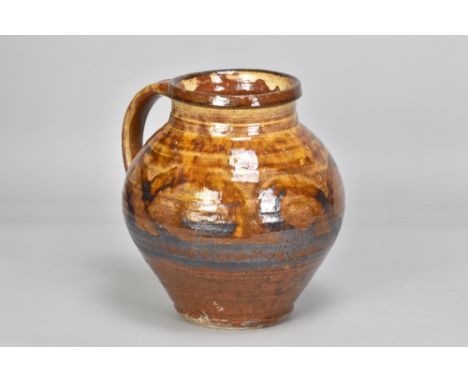 Attributed to MICHAEL CARDEW (1901-1983) for Winchcombe Pottery; a large slipware vessel with side handle, iron brush decorat