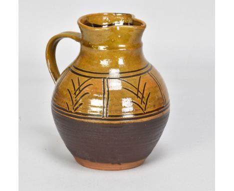 MICHAEL CARDEW (1901-1983) for Winchcombe Pottery; a slipware jug with simple abstract sgraffito decoration under a manganese