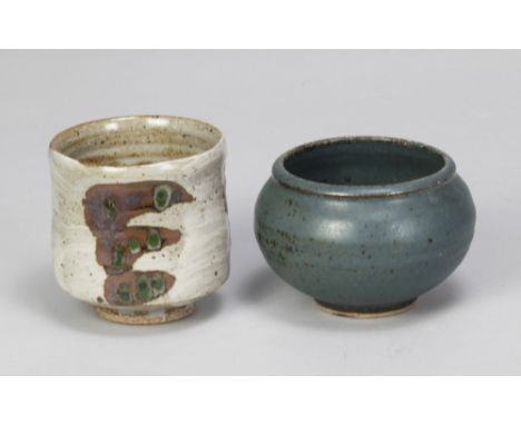 Leach Pottery; a stoneware yunomi, iron and copper decoration on hakeme ground, impressed pottery mark, height 8.5cm, and a s