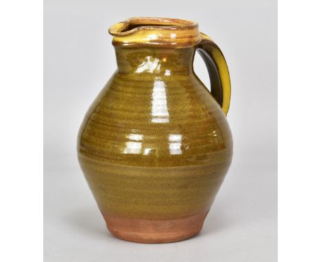 Attributed to BERNARD LEACH (1887-1979) for Leach Pottery; a large slipware jug with yellow slip to rim and handle and green 