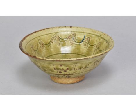 JIM MALONE (born 1946); a small footed bowl covered in green ash glaze with incised decoration, impressed JM mark, diameter 1