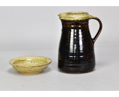 RICHARD BATTERHAM (born 1936); a stoneware jug, height 21.5cm, and shallow dish (2). (D)Additional InformationChip to dish ri