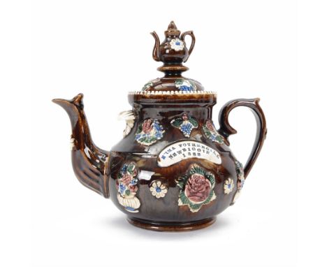 Large Victorian Bargeware teapot, the plaque inscribed 'Emma Fothergill Newbiggin, 1882', with applied flowers and foliage, t