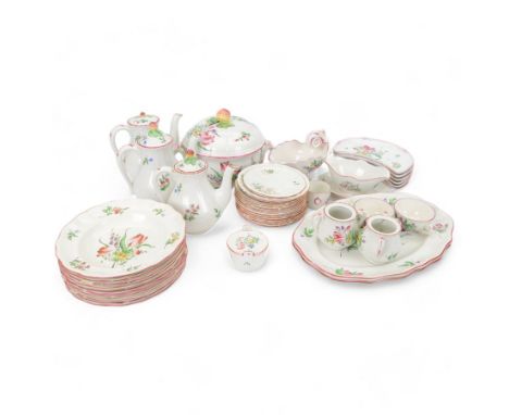 Keller & Guerin Luneville French part tea and dinner service,painted with floral sprays and scattered sprigs within pink edge