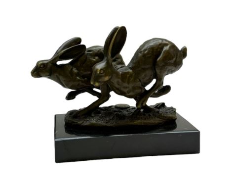 Bronze figure group, modelled as two hares in chase, signed Nick, with foundry mark, upon a rectangular base, H11cm L15cm