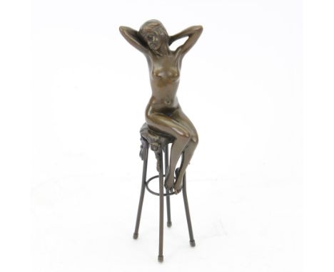 Bronze figure, modelled as a female figure with arms above her head seated upon a chair, signed D H Chipans H28cm