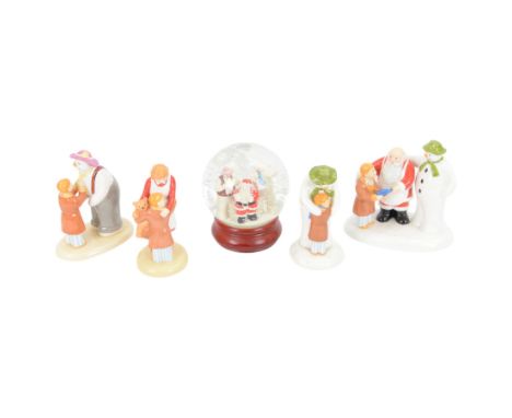 Four Coalport Characters The Snowman figures, comprising The Finishing Touch, Hug For Mum, The Hug and The Special Gift, and 