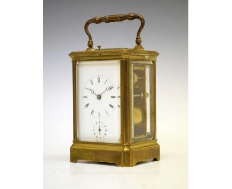 Late 19th Century brass repeater carriage clock, the white Roman dial with Breguet-style moon hands over subsidiary alarm dia