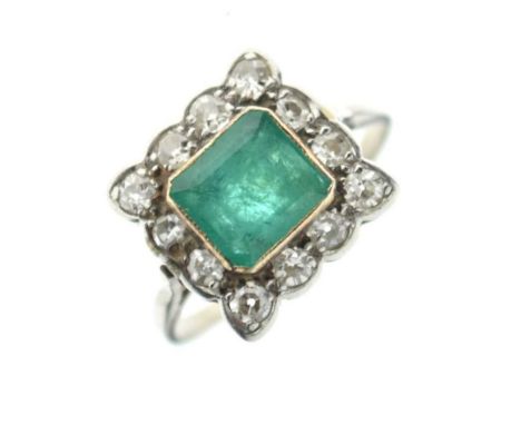 Emerald and diamond cluster ring, the white mount stamped '18ct' and 'Plat', the square-cut emeralds enclosed by twelve singl