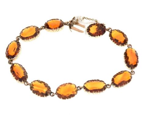 Late Victorian citrine bracelet, in unmarked gold, the eleven oval cuts collet set, approximately 18cm long, 13.5g gross appr