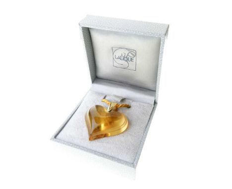 Lalique, a citrine-coloured glass heart-shaped pendant, signed Lalique to the reverse and to the bale, on a cord, in the orig