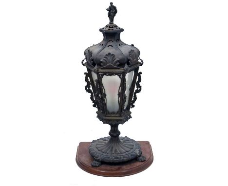 Early 20th Century bronzed lantern, the hexagonal corona with figural surmount over tapered frame inset with six glazed panel