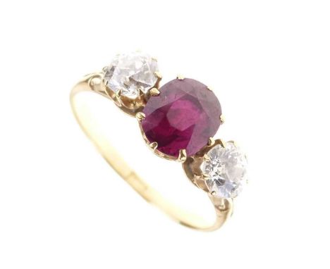 Ruby and diamond three-stone ring, the yellow mount with indistinct mark, the two old cut diamonds totalling approximately 0.