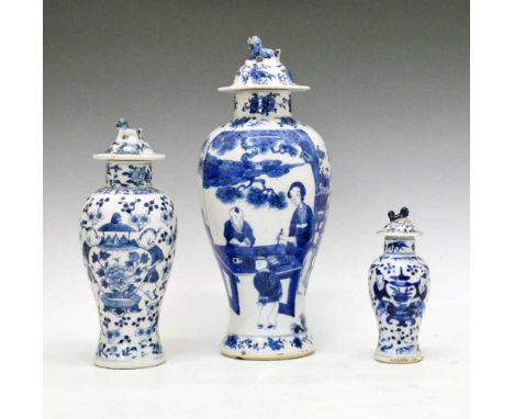 Three Chinese blue and white porcelain baluster vases, the largest depicting a 'Long Eliza' and boy in a garden holding lingz