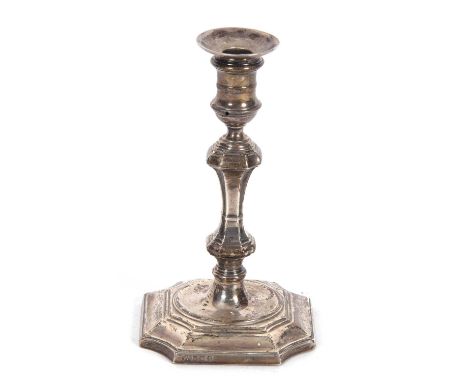 George V taper stick in George II style having shaped square loaded base, knopped stem, integral sconce, 12cm tall, Sheffield